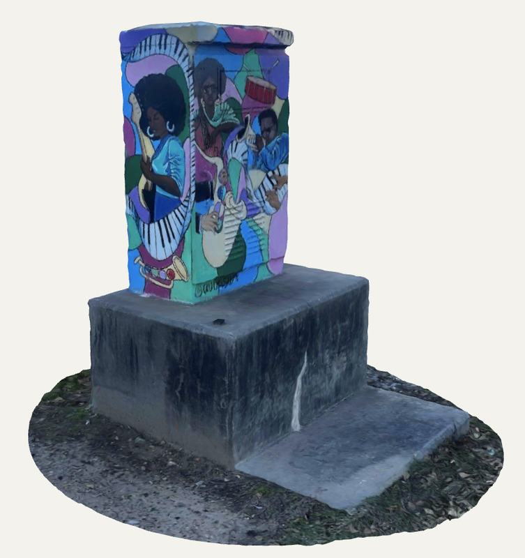 A three-quarter view shows a painted utility box mounted on a rectangular concrete base. The mural uses bright blues, greens, pinks, and purples to depict several Black musicians playing instruments, including a guitar, saxophone, and drums, within overlapping curved shapes.