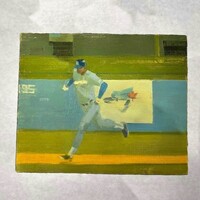 A small painting depicts a baseball player running across a baseball field, wearing a light-colored uniform and blue cap. The background features green and blue stadium seating and a blurred advertisement, with yellow and green tones dominating the scene.